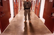 soldier patrolling the halls of Guantanamo