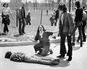 A Kent State student kneels over a murdered protester