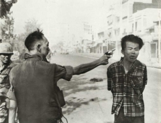 Viet Cong guerrilla being shot in head