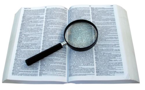 magnifying glass on book